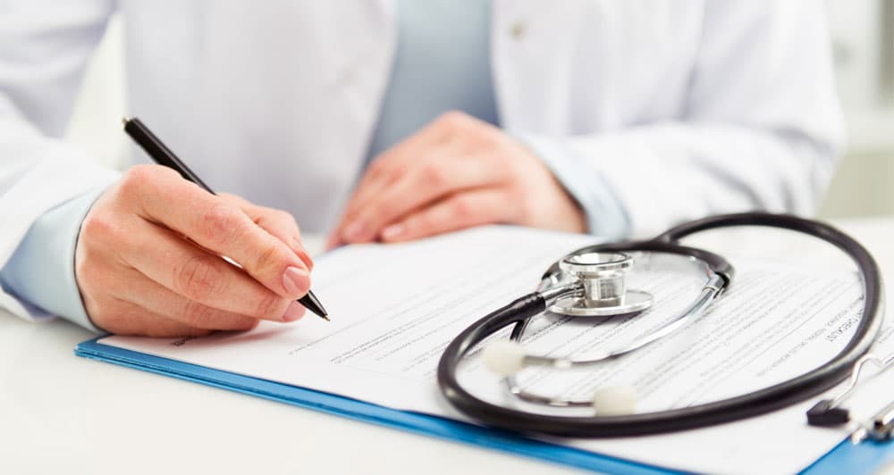 A doctor doing paperwork